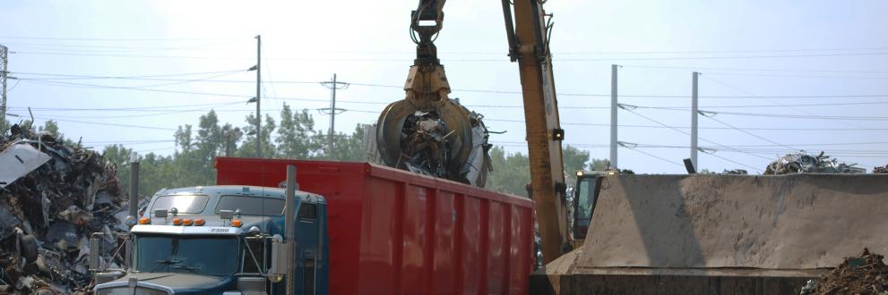 Yellow GSG grapple loading truck