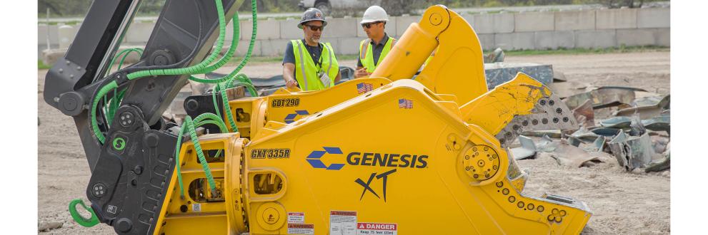 Two people standing behind two Genesis attachments