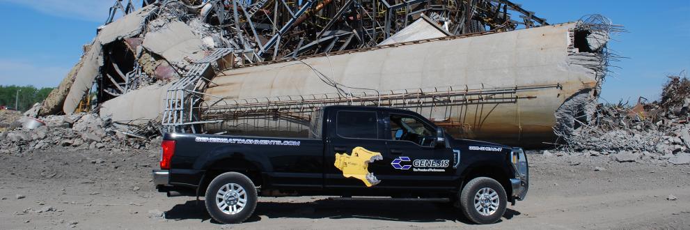 Genesis service truck in front of steel beam and cement pile