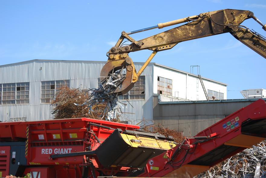 Yellow GSD grapple loading truck