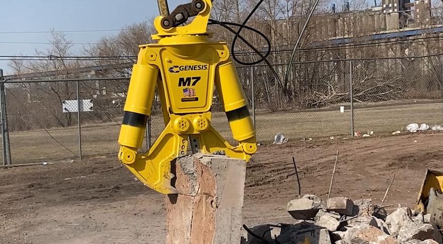 Yellow M7 breaking a piece of concrete